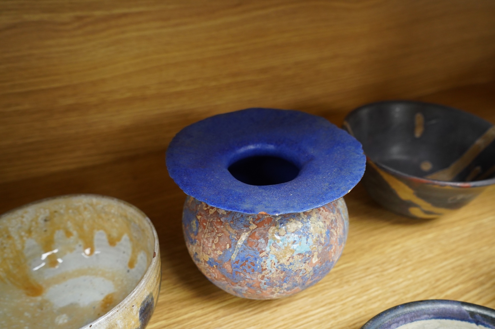 A collection of studio pottery to include crystalline glazed works by Stephen R Jones Des, Brighton, vases and a pair of dishes, largest 22cm high